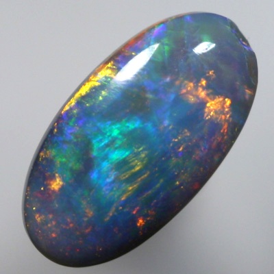 SOLID SEMI BLACK OPAL Golds over green and blue